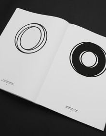 Book cover of Letters as Symbols: International Collection of Lettermarks, with a collection of black symbols. Published by Hopper&Fuchs.