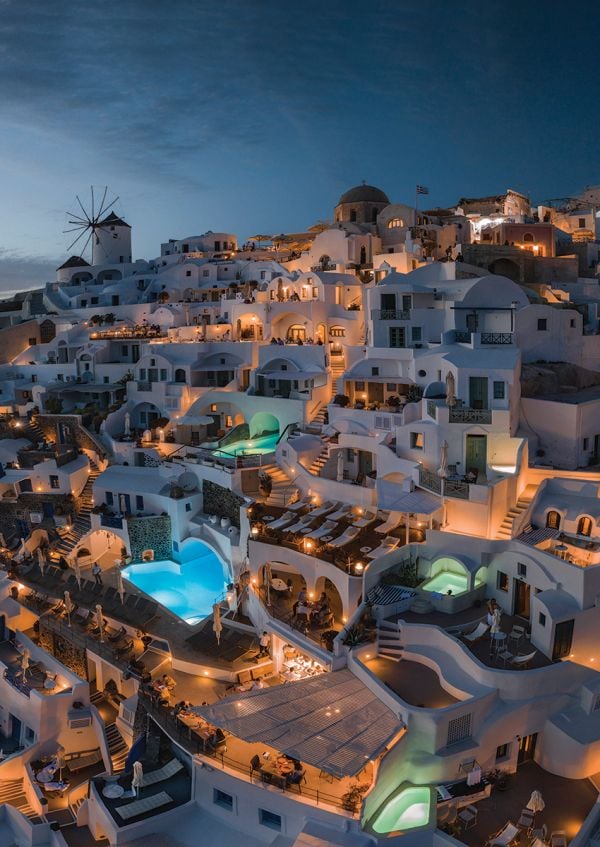 Book cover of Man Made, Aerial Views of Human Landscapes, with an aerial shot of house surrounded by boats on water. Published by Lannoo Publishers.