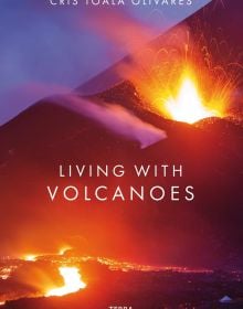 Spectacular shot of volcano spewing bright white and orange lava, on cover of 'Living With Volcanoes', by Lannoo Publishers.