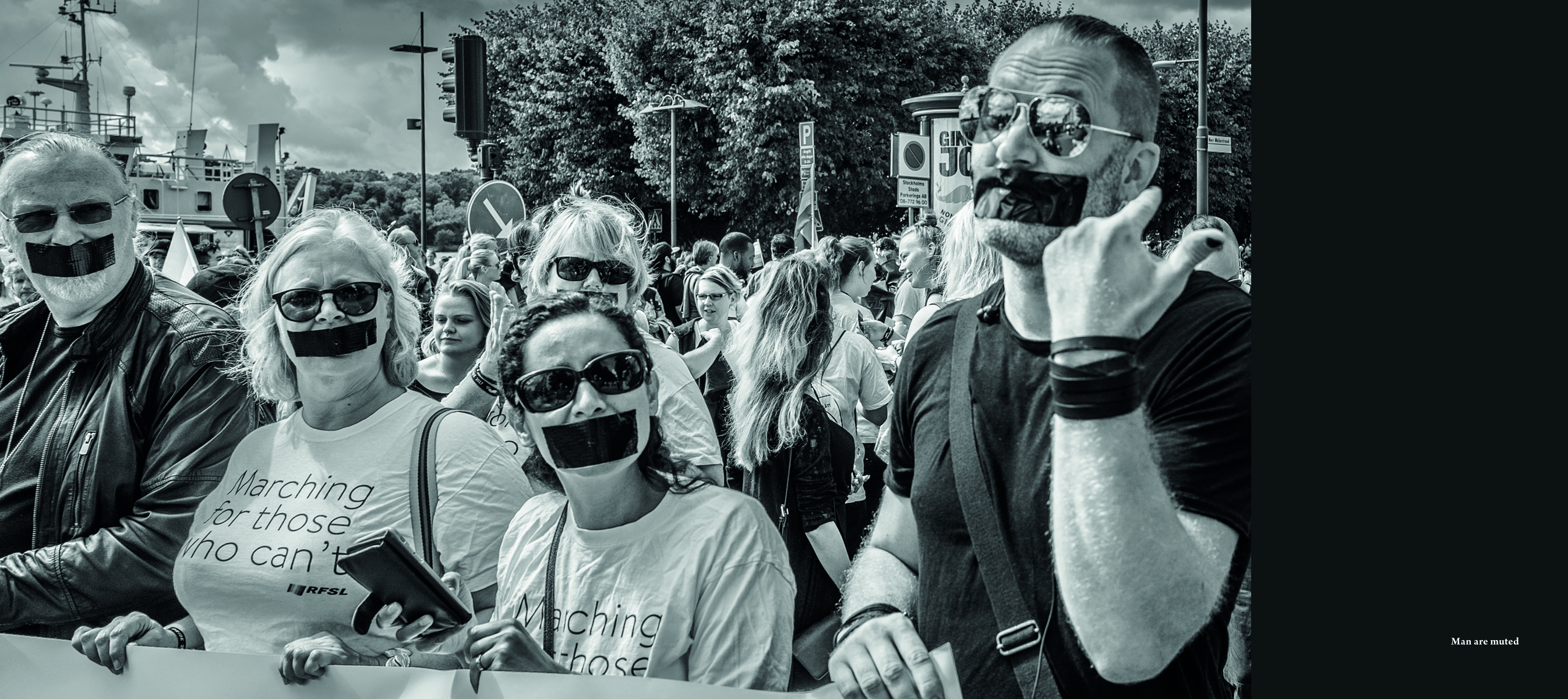 Shot of group of people with black tape covering their mouths, thoughts about mankind Christer Lofgren in black font on left grey banner.