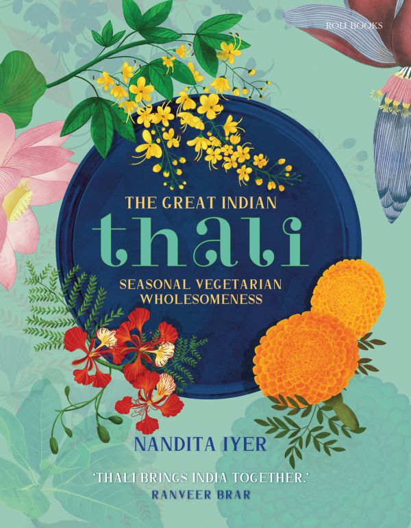 Book cover of The Great Indian Thali, Seasonal Vegetarian Wholesomeness, with a blue plate with colorful orange, yellow, and pink flowers. Published by Roli Books.