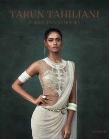Book cover of Tarun Tahiliani: Journey to India Modern, with a model in white dress with beaded bodice. Published by Roli Books.