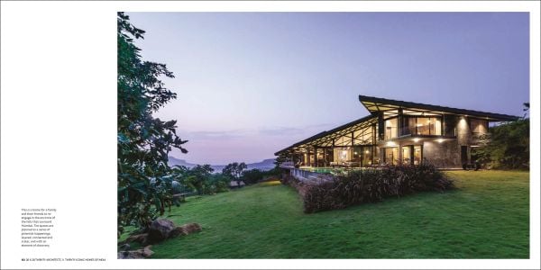 Book cover of 20 x 20: Twenty Architects x Twenty Iconic Homes of India, featuring a residential property with large concrete steps leading into patio doors. Published by Roli Books.