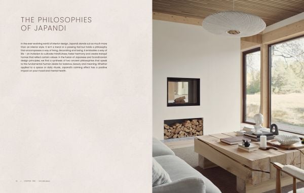 Book cover of Japandi: Serene Homes and Thoughtful Living, with a calming, natural color living interior with soft sofas and a view through large windows of a lake. Published by Lannoo Publishers.