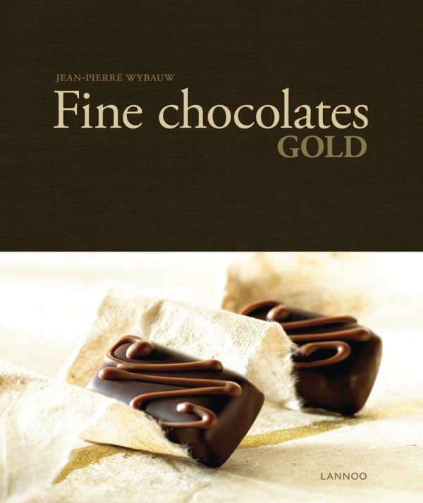 Book cover of Fine Chocolates: Gold; with two luxury chocolates with caramel swirls on top. Published by Lannoo Publishers.