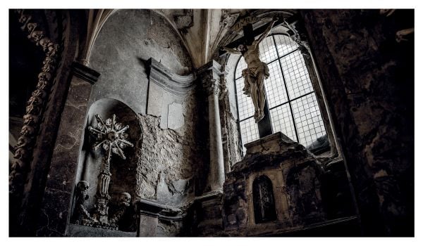 Book cover of Mothmeister: Sinister and Spiritual Post-Mortem Fairy Tales, featuring a dark figure with a black cockerel. Published by Lannoo Publishers.