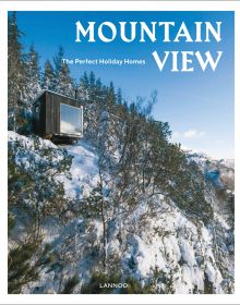 Modern wood holiday home nestled in snowy mountain side under bright blue sky on cover of 'Mountain View The Perfect Holiday Homes', by Lannoo Publishers.