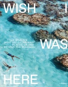 Two swimmers in turquoise sea with rocks, on cover of 'Wish I Was Here, The World's Most Extraordinary Places on and Beyond the Seashore', by Lannoo Publishers.