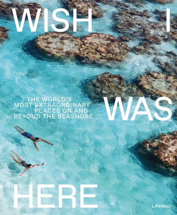 Book cover of Wish I Was Here, The World's Most Extraordinary Places on and Beyond the Seashore, with two swimmers in turquoise sea. Published by Lannoo Publishers.