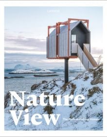 Modern, luxury cabin on remote Norwegian island, covered in snow, on cover of 'Nature View, The Perfect Holiday Homes', by Lannoo Publishers.