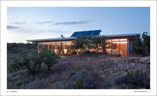 Modern, luxury cabin on remote Norwegian island, covered in snow, on cover of 'Nature View, The Perfect Holiday Homes', by Lannoo Publishers.