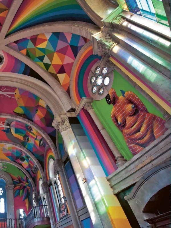 Two artists abseiling down building painting a large gold circle on white concrete, on cover of 'Street Art Today II, The 50 Most Influential Street Artists Today', by Lannoo Publishers.