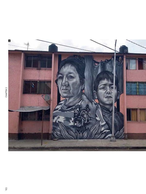 Two artists abseiling down building painting a large gold circle on white concrete, on cover of 'Street Art Today II, The 50 Most Influential Street Artists Today', by Lannoo Publishers.