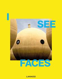 Sphere shape building structure with 2 port holes and small tower to top, resembling face, on yellow cover of 'I See Faces', by Lannoo Publishers.