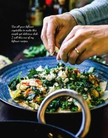 Plate of fish cakes on bed of green cabbage, pot of utensils to side, on cover of 'Low Carb Cookbook with 4 Ingredients 2, by Lannoo Publishers.