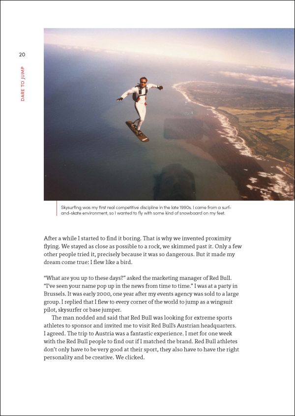 Skydiver in Red Bull wingsuit, gliding high up over Pyramids, on cover of 'Dare to Jump, Everything You Want is on the other Side of Fear', by Lannoo Publishers.