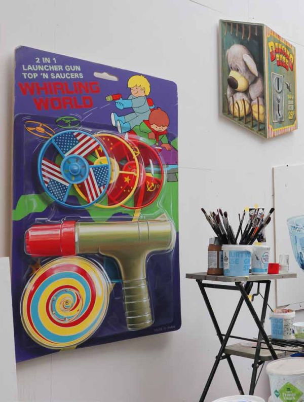 3D cover: red emergency fire alarm box filled with childhood toys, on cover of 'In Case of Lost Childhood, Leon Keer 3D Artworks', by Lannoo Publishers.