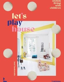 Home interior of children's play area, cardboard castle on floor, on orange cover of 'Let's Play House, Inspirational Living With Kids', by Lannoo Publishers.