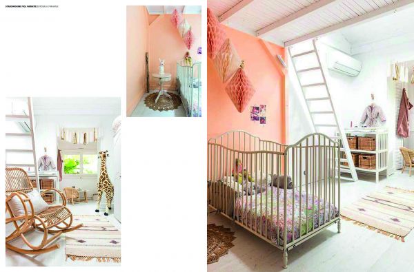 Home interior of children's play area, cardboard castle on floor, on orange cover of 'Let's Play House, Inspirational Living With Kids', by Lannoo Publishers.