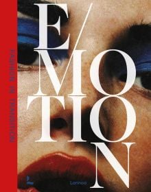 Fashion model with bright blue eyeshadow and red lipstick, on cover of 'Emotion, Fashion in Transition', by Lannoo Publishers.