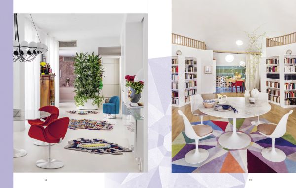 Book cover of Carpets & Rugs, Every home needs a soft spot, with an interior with navy wall panelling, large black and white rug, and arched windows. Published by Lannoo Publishers.