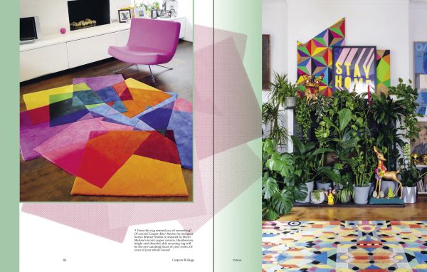 Book cover of Carpets & Rugs, Every home needs a soft spot, with an interior with navy wall panelling, large black and white rug, and arched windows. Published by Lannoo Publishers.