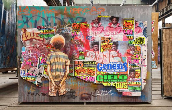 Charcoal cover with small triangular image of smiling face with multicoloured patterns on cover of 'STRAAT, Quote from the streets', by Lannoo Publishers.