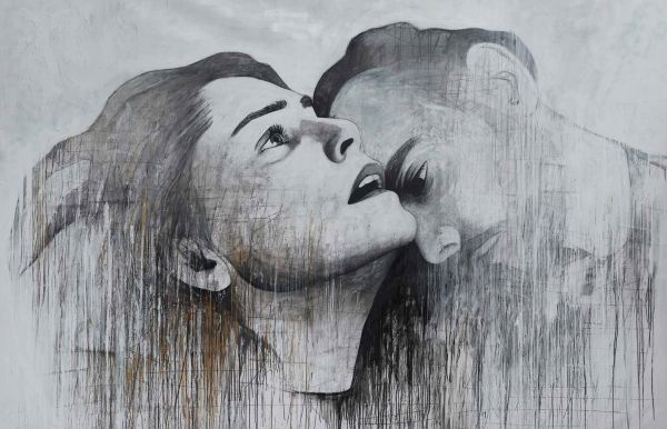 Charcoal cover with small triangular image of smiling face with multicoloured patterns on cover of 'STRAAT, Quote from the streets', by Lannoo Publishers.