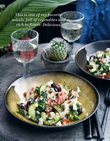 Wicker basket of green and brown skinned avocados, on wood table, on cover of 'The Keto Cure 2, A New Life in 14 Days', by Lannoo Publishers.