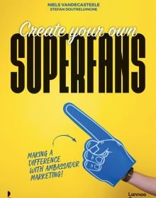 Book cover of Create Your Own Superfans, Making a Difference With Ambassador Marketing, with a giant blue foam pointed finger. Published by Lannoo Publishers.