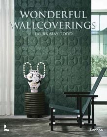 Interior living space with green wall cover with embossed pattern, Zeilmaker chair in foreground, on cover of 'Wonderful Wallcoverings', by Lannoo Publishers.