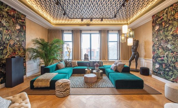 Book cover of Wonderful Wallcoverings, with an interior living space with green wallpaper with a textured pattern. Published by Lannoo Publishers.