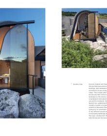 Modern home with glass side, built on cliff edge with mountains behind, under blue sky, on cover of 'Living on the Edge', by Lannoo Publishers.
