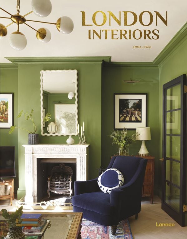 Book cover of London Interiors, featuring an interior living room with high ceiling, green walls, a blue velvet chair, and fireplace. Published by Lannoo Publishers.