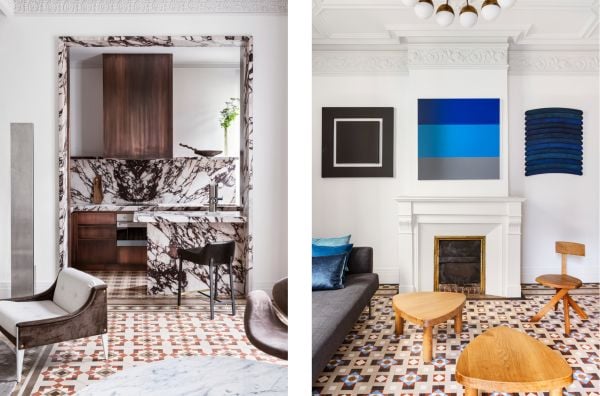 Book cover of Barcelona Interiors, with a white Mediterranean interior space with white sofa, low hanging light, and family portrait painting on wall. Published by Lannoo Publishers.