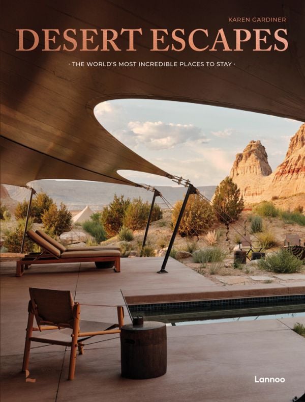 Book cover of Desert Escapes, with sun-loungers looking across a desert landscape, under a canvas canopy. Published by Lannoo Publishers.