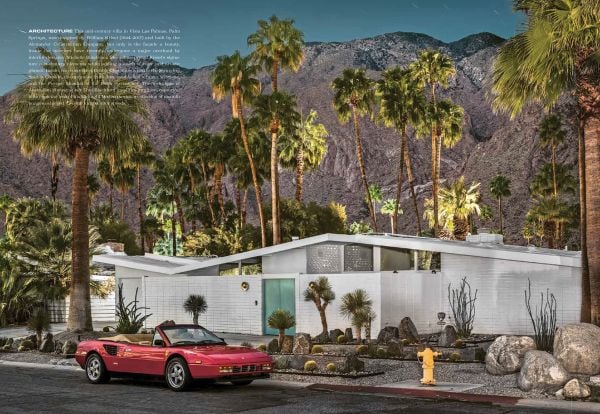 Book cover of Carchitecture USA: American Houses With Horsepower, with a blue Cadillac parked outside the front of a pink, flat-roofed house, with palm trees and the sea behind. Published by Lannoo Publishers.