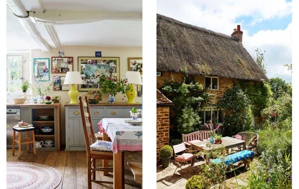Book cover of Living in Country Style, with interior with white panelled walls, blue floral wallpaper, and two windows looking out to hilly landscape. Published by Lannoo Publishers.