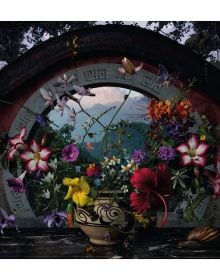 Book cover of Flower Pieces, A Photographic Journey Around the World, with flame coloured tulip and white Lily-of-the-Valley bell-shaped flowers. Published by Lannoo Publishers.