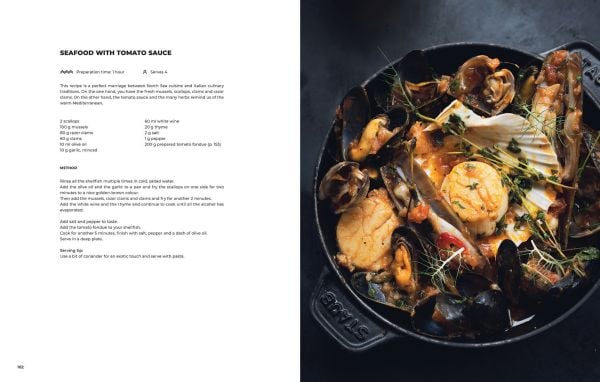 Book cover of Door 73, featuring two male chefs smiling at camera. Published by Lannoo Publishers.