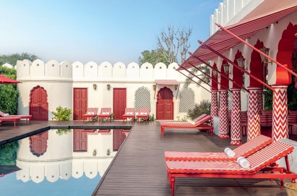 Book cover of The World's Best Art and Design Hotels, with the Le Grand Mazarin hotel with interior swimming pool. Published by Lannoo Publishers.