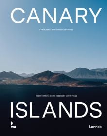 Book cover of Canary Islands: A Visual Travel Guide Through the Canarias, with a mountainous landscape. Published by Lannoo Publishers.