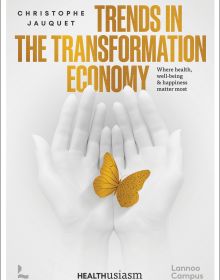 Book cover of Christophe Jauquet's Trends in the Transformation Economy: Where Health, Well-Being & Happiness Matter Most, with a pair of hands folding a gold butterfly. Published by Lannoo Publishers.