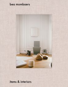 Book cover of Bea Mombaers, Items & Interiors, with interior living space with wood table, white walls. Published by Luster Publishing.