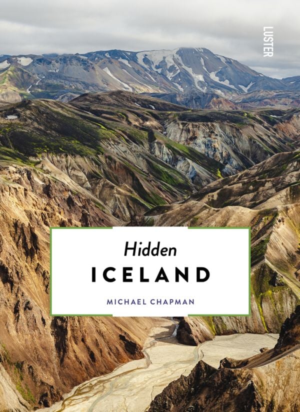 Book cover of Hidden Iceland, with an aerial view of mountainous landscape. Published by Luster Publishing.