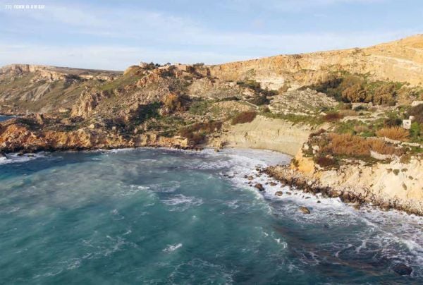 Book cover of Hidden Malta, with a row of multicoloured wooden seats, near harbour edge, with boat behind. Published by Luster Publishing.