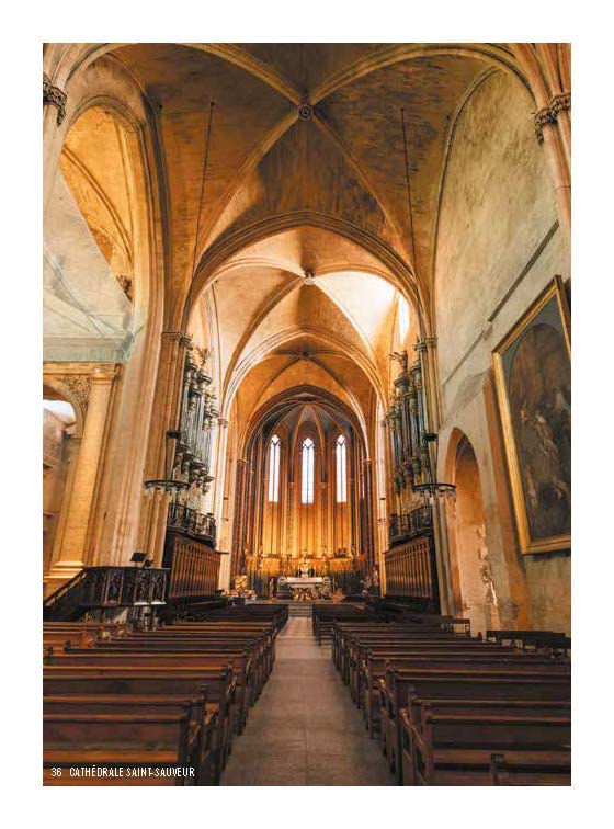 Graffitied building with cypress cloud tree, on pale yellow cover of 'The South of France for Art Lovers', by Luster Publishing.
