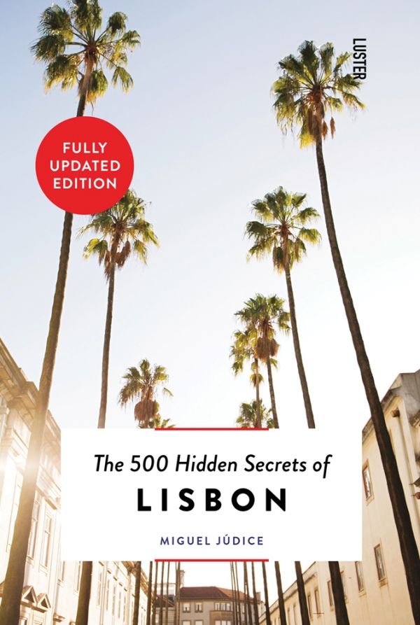 Book cover of The 500 Hidden Secrets of Lisbon, with a row of towering palm trees down sunny street. Published by Luster Publishing.