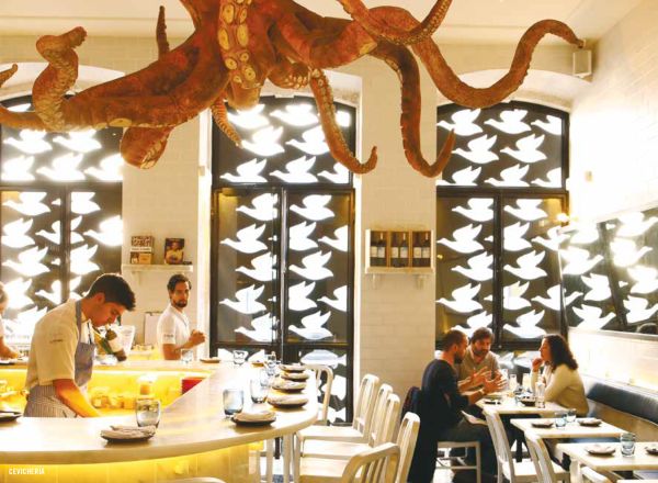 Book cover of The 500 Hidden Secrets of Lisbon, with a row of towering palm trees down sunny street. Published by Luster Publishing.