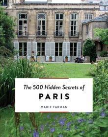 Book cover of The 500 Hidden Secrets of Paris, featuring the Hotel d'Assy and lush green gardens. Published by Luster Publishing.